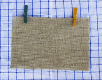 High angle view of clothespin in sack on table
