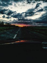 Road against sky seen through car windshield