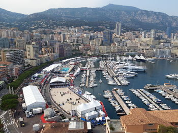 High angle view of harbor by buildings in city