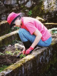 Woman planting at yard