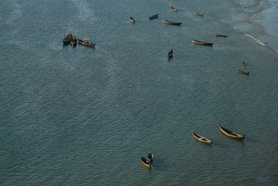 High angle view of fishing boats anchoring in bay