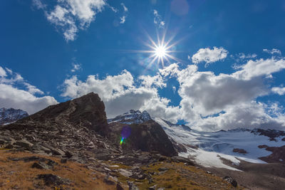 Sunny panorama of barba d'orso glacier under a blue sky with clouds, alto adige