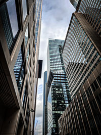 Low angle view of modern buildings against sky