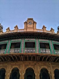 Low angle view of old building against clear sky