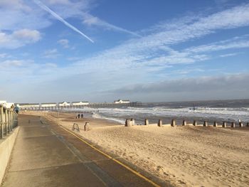 View of beach against cloudy sky