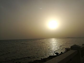 Scenic view of sea against sky at sunset