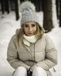 Portrait of young woman in snow