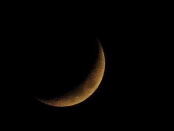 Low angle view of moon against sky at night