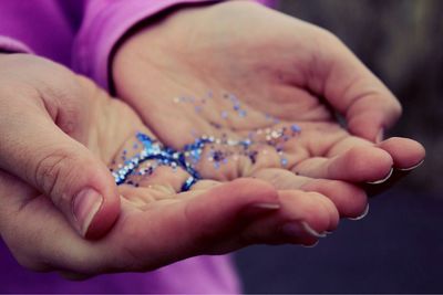 Close-up of person holding hands