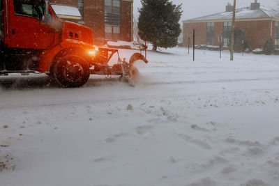 Snow covered car on street