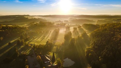 Aerial view of landscape against sky during sunset