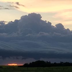 Scenic view of landscape against cloudy sky