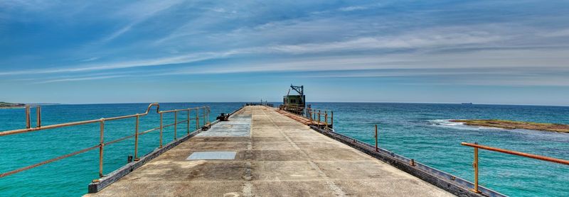 Scenic view of sea against blue sky