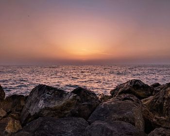 Scenic view of sea against sky during sunset