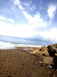 Scenic view of beach and sea against sky