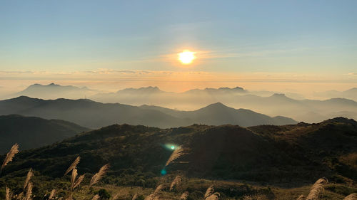 Scenic view of mountains against sky during sunset