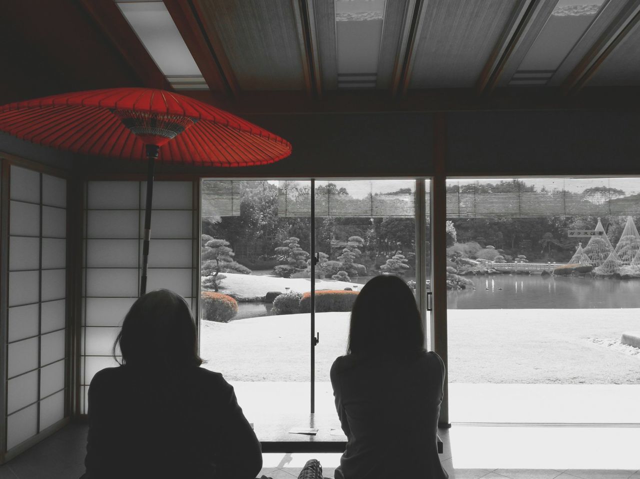 SILHOUETTE PEOPLE IN SNOW AT WINDOW