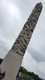 Low angle view of statue against sky