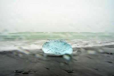 Scenic view of sea against sky during winter