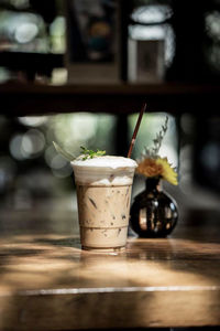 Close-up of coffee served on table at cafe