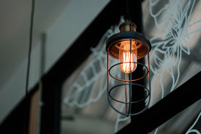 Low angle view of illuminated light bulb