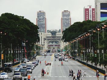 People on city street amidst buildings