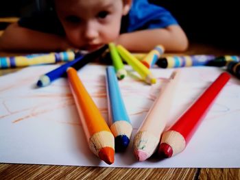 Close-up of multi colored pencils on table