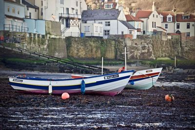 Boats moored at waterfront