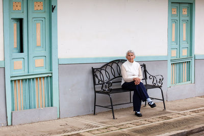 Senior woman traveling at the small town of salento, located on the region of quindio in colombia