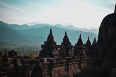 Stupas of temple against sky