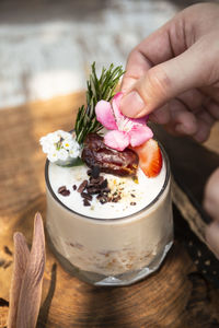 Close-up of hand holding dessert