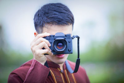 Portrait of man photographing