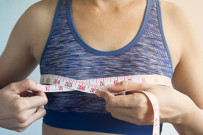 Midsection of woman holding hands