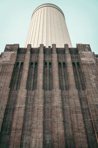 Low angle view of battersea power station against sky