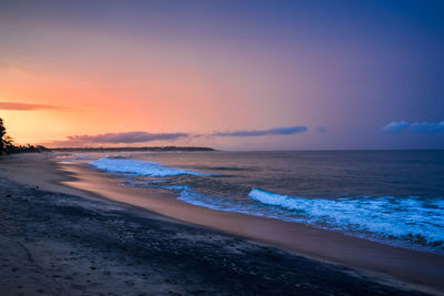 Scenic view of beach against sky during sunset, arugam bay, sri lanka