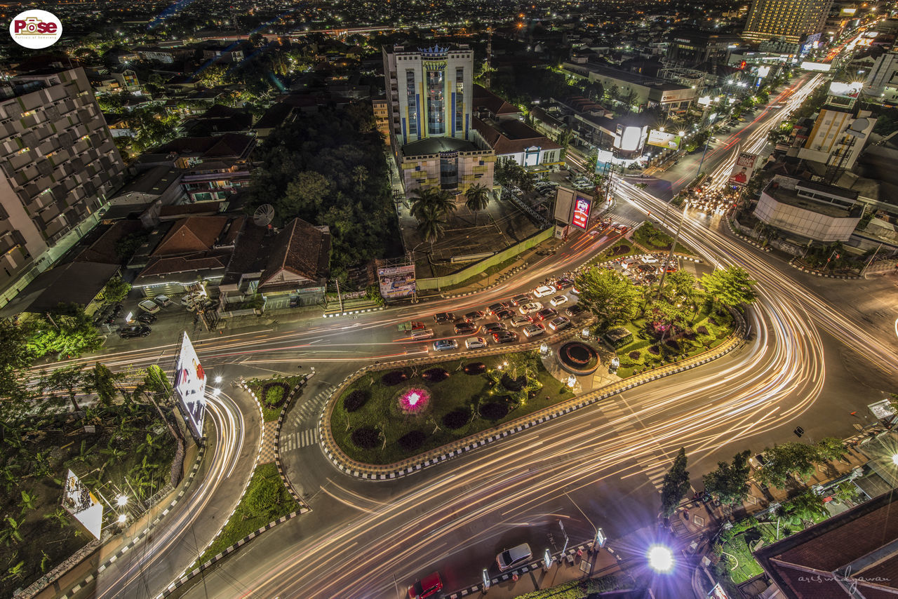 HIGH ANGLE VIEW OF LIGHT TRAILS ON HIGHWAY IN CITY