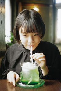 Portrait of boy drinking glass