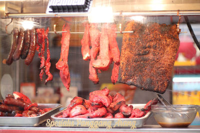 Close-up of meat on barbecue grill