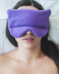 Portrait of a beautiful young woman covering face