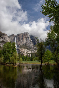 Scenic view of lake against cloudy sky