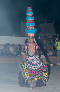 Woman with multi colored umbrella