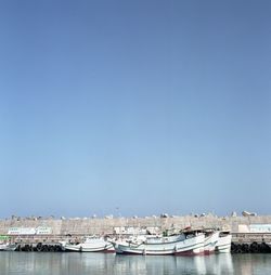 View of built structures against clear blue sky