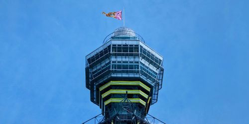 Low angle view of building against blue sky