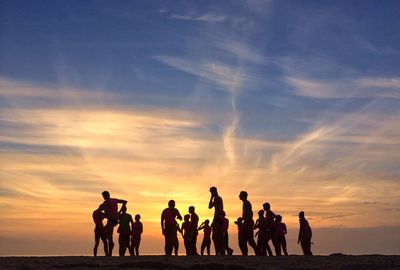 Silhouette of people at sunset