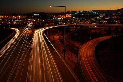 High angle view of light trails on road at night