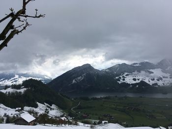 Scenic view of snowcapped mountains against sky