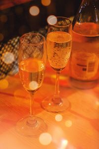 Close-up of wine glasses on table