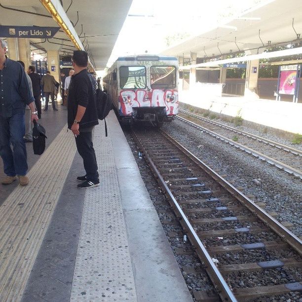 railroad track, rail transportation, public transportation, railroad station platform, transportation, railroad station, train - vehicle, travel, men, passenger, passenger train, lifestyles, mode of transport, journey, train, person, public transport, indoors, railway station platform