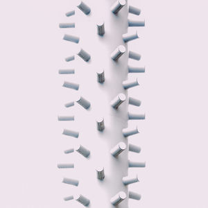 Close-up of pipes over white background