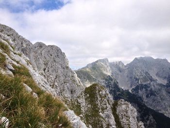 Scenic view of mountains against cloudy sky